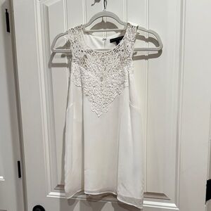 White sleeveless top